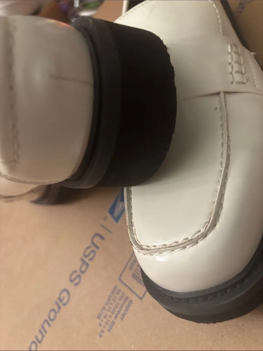 NWOT Guess White Slip-On Penny Loafers with Gold Triangle Logo
